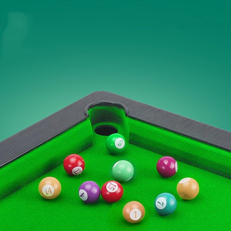 Pool table with scattered balls on a green felt surface